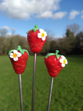 Glass Strawberry with a little flower