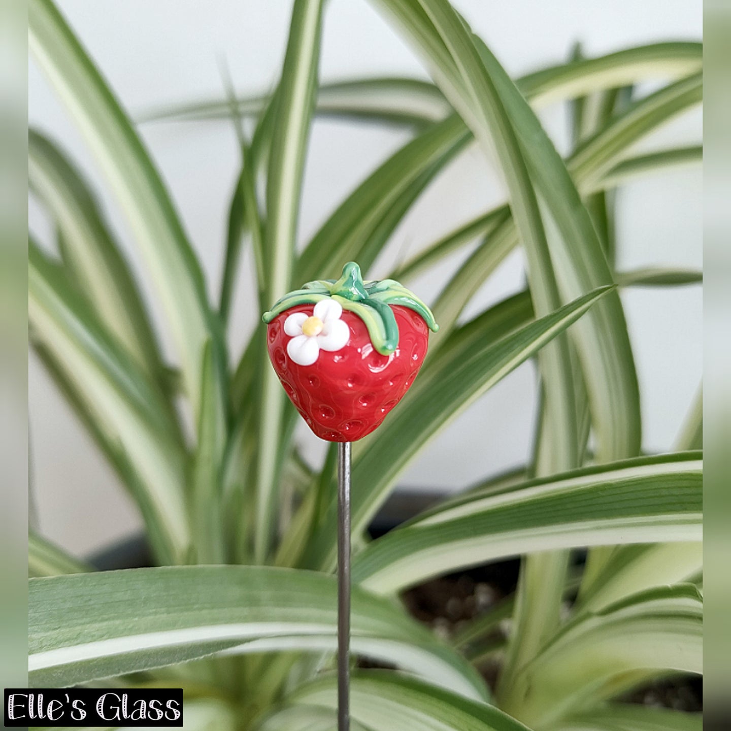 Glass Strawberry with a little flower